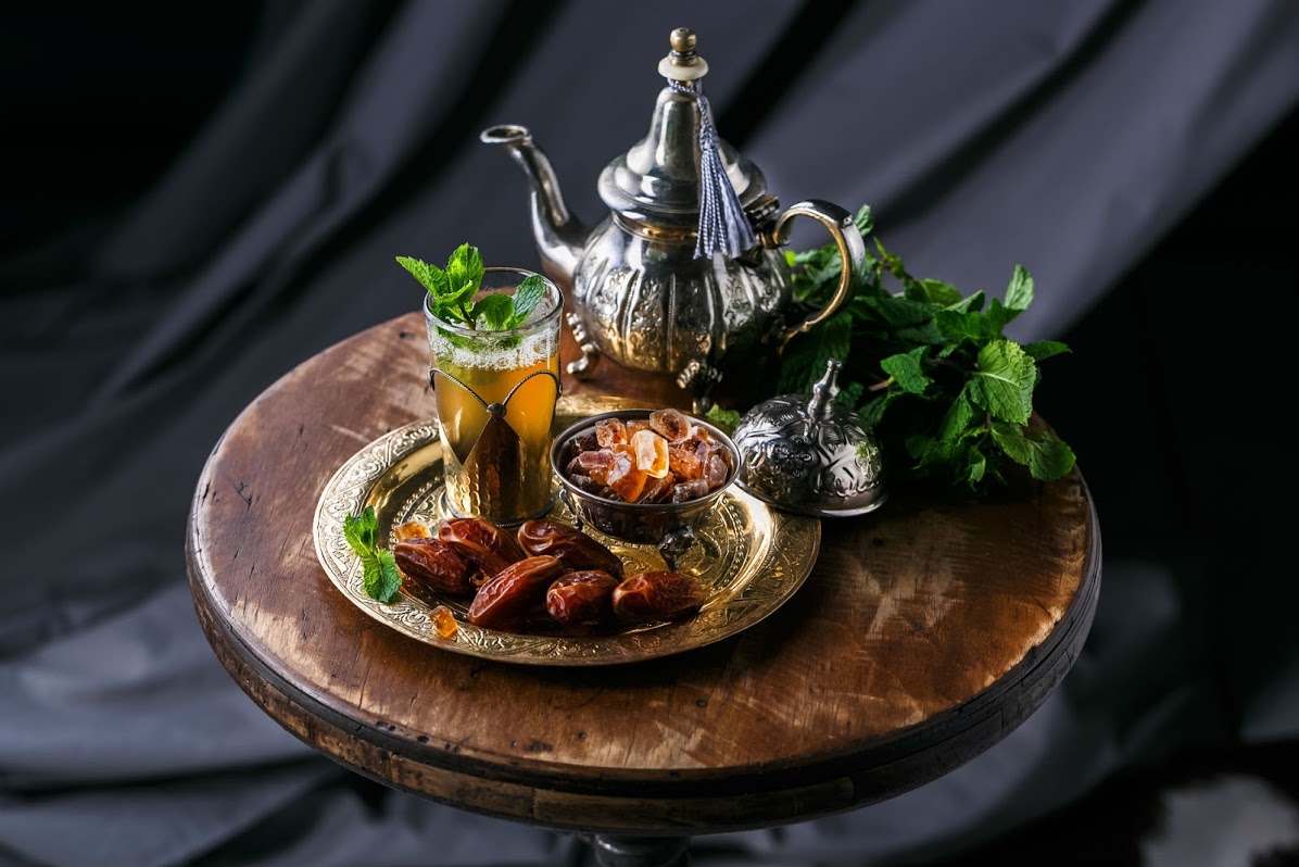 Traditional Middle Eastern beverages including mint tea service with authentic copper serving set